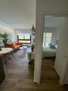 a living room with a couch and a table at Apartment Valentino Golf 3 in Villamartin +13 photos