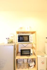 Kuchyň nebo kuchyňský kout v ubytování 大阪城公園 6分鐘森之宮站 2層日式小屋 2臥室 獨立衛浴