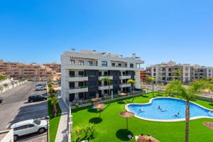 an apartment with a swimming pool and a street at Apartment Valentino Golf 3 in Villamartin