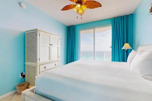 a bedroom with a bed and a large window at Majestic Sun 913A Miramar Beach (Condo) in Destin