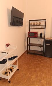 TV a/nebo společenská místnost v ubytování Friendly Home 3 trilocale + 27 fotografií