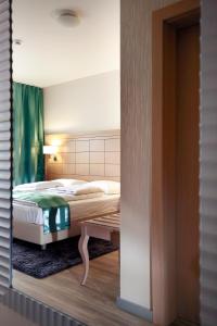 Posteľ alebo postele v izbe v ubytovaní Hotel Raca