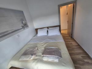 Postel nebo postele na pokoji v ubytování Anastasia Beach House Haraki