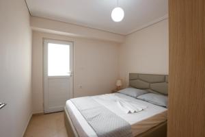 Voodi või voodid majutusasutuse Ariadne 7 Apartments toas