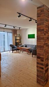 Зона вітальні в Apart hotel In DIlijan , Designed by Khi