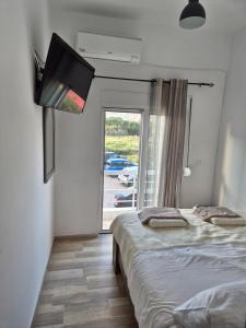 Postel nebo postele na pokoji v ubytování Anastasia Beach House Haraki