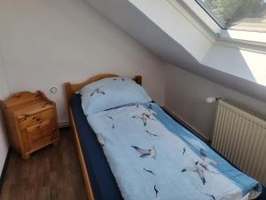Ein Bett oder Betten in einem Zimmer der Unterkunft Ferienwohnungen Brasse