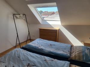 Ein Bett oder Betten in einem Zimmer der Unterkunft Ferienwohnungen Brasse