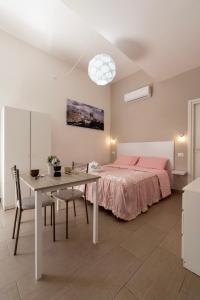 Katil atau katil-katil dalam bilik di Residence la via del mare