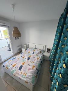 Postel nebo postele na pokoji v ubytování Appart familial à 800 m de la plage ! + 13 fotografií