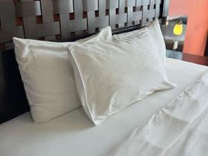 Postel nebo postele na pokoji v ubytování SUNVAY RESORT SUITe