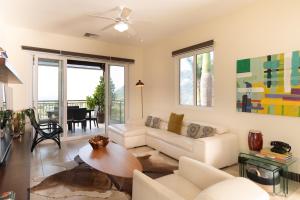 a living room with a white couch and a table at CR Luxury Altavista 2B 3 Bdrm in La Mona