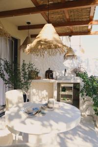 a table and chairs in a kitchen with a stove at The Residence in Šibenik