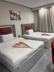 Giường trong phòng chung tại Scandic سكاندك