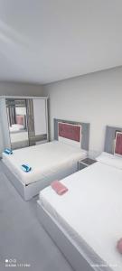 Giường trong phòng chung tại Scandic سكاندك