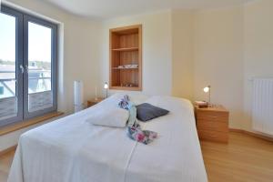 Postel nebo postele na pokoji v ubytování Ferienhaus Leuchtturm