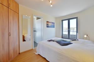 Postel nebo postele na pokoji v ubytování Ferienhaus Leuchtturm