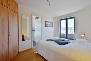 Postel nebo postele na pokoji v ubytování Ferienhaus Leuchtturm