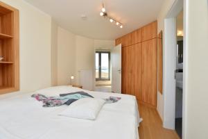 Postel nebo postele na pokoji v ubytování Ferienhaus Leuchtturm