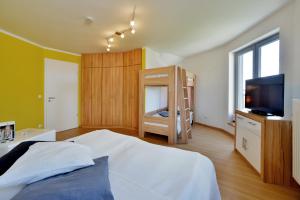 Postel nebo postele na pokoji v ubytování Ferienhaus Leuchtturm