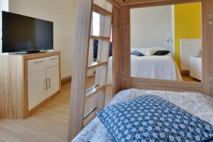 Postel nebo postele na pokoji v ubytování Ferienhaus Leuchtturm