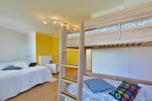Postel nebo postele na pokoji v ubytování Ferienhaus Leuchtturm