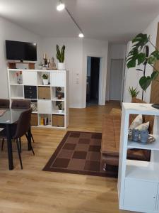 a living room with a couch and a table at Ferienwohnung Toni in Memmingen