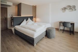 Postel nebo postele na pokoji v ubytování Hotel Lisetta