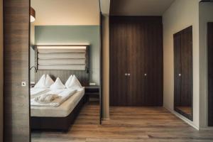 Postel nebo postele na pokoji v ubytování Hotel Lisetta