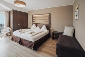 Postel nebo postele na pokoji v ubytování Hotel Lisetta