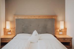 Postel nebo postele na pokoji v ubytování Hotel Lisetta