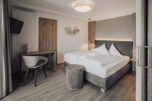 Postel nebo postele na pokoji v ubytování Hotel Lisetta