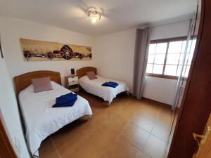 Posteľ alebo postele v izbe v ubytovaní Casa Ana Perez