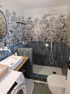 a bathroom with a toilet and a sink at WOW Pool Feel Like Home Villa in Schinias