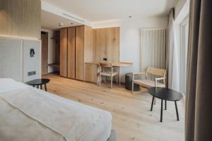 Postel nebo postele na pokoji v ubytování Hotel Lisetta