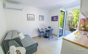 a living room with a couch and a table at Stari View-Free Parking in Mostar