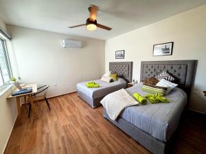Hotel Vive Jarocho-APT y Domo a 5 min Playa客房内的一张或多张床位