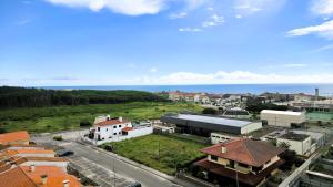 an aerial view of a city with the ocean at Amorosa Beach Apartment Sea View in Viana do Castelo