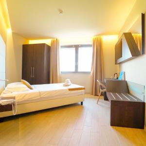 Postel nebo postele na pokoji v ubytování Hotel Terre Dei Salici