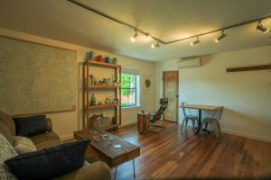 a living room with a couch and a table at BrewPub Bungalow #1 in Oakridge