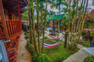 an aerial view of a playground with palm trees at Poshtel Arenal in Fortuna