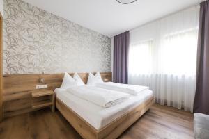 Postel nebo postele na pokoji v ubytování Ferienwohnungen Alber + 37 fotografií