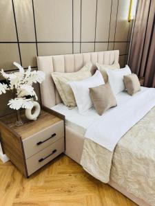 Postel nebo postele na pokoji v ubytování Шикарные LUX апартаменты Шымкента
