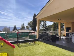 a patio with a soccer goal on the grass at La casa amarilla in El Barraco