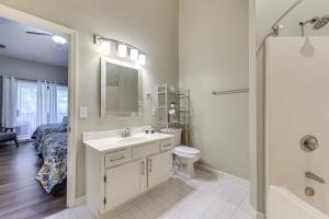 a bathroom with a sink and a toilet and a shower at Resort Condo about 2 Mi to Sunset Beach Seashore! in Sunset Beach +18 photos