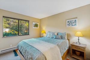 a bedroom with a bed and a window at Bowsprit Retreat in Sea Ranch