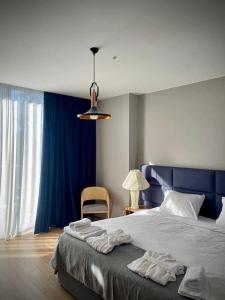 Ένα ή περισσότερα κρεβάτια σε δωμάτιο στο Flat in Bakuriani forest