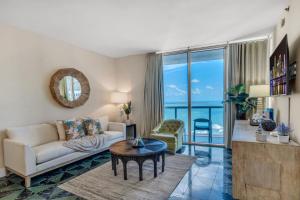 a living room with a couch and a table at Icon Brickell Gem 2-BR Oasis with Amazing Views in Miami