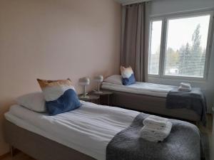Ένα ή περισσότερα κρεβάτια σε δωμάτιο στο Convenient Apartment for 3