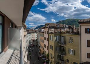 a view of a city street from a building at Stay COOPER l Capitol Rooms in Bolzano